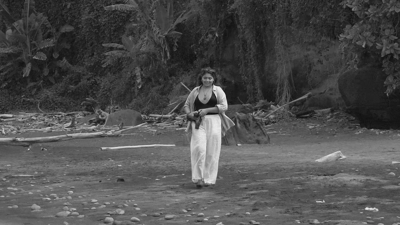Leslie photographing on the beach